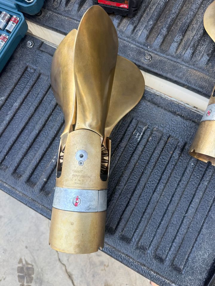 A bronze folding propeller on the hardstand